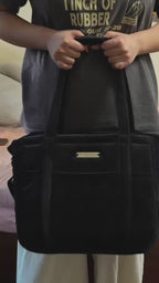 Black organiser bag with a shoulder strap and a crossbody strap video